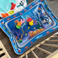 Alfombra sensorial de agua para bebés