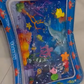 Alfombra sensorial de agua para bebés